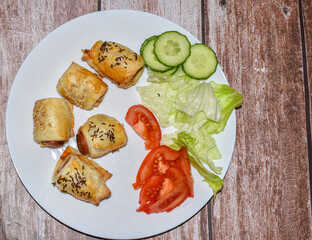 Homemade sausages in pastry with vegetables