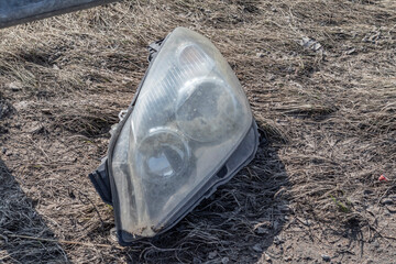 street lighting. car headlight close-up on the side of the road. The element of the car after the accident. Close-up.