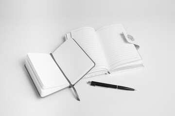 open notepads and pen for a make a plan on a white background