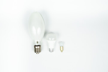 three diode lamps of different sizes on a white background