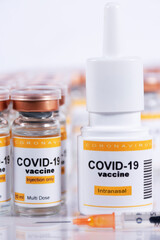 Inhaler with intranasal coronavirus vaccine, syringe and vials