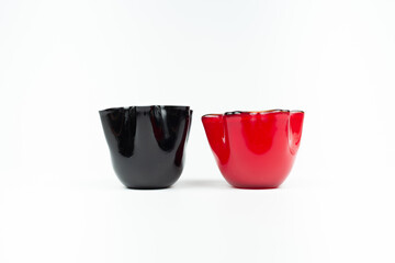 black and red candle holder a white background.