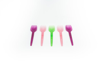colorful plastic dessert spoons