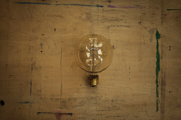 Vintage bulb on wooden table