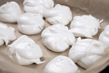 Fototapeta na wymiar meringue on parchment paper cooking process