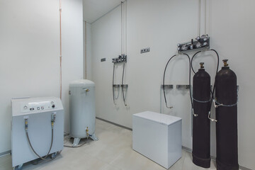 Hospital room with oxygen equipment. Oxygen generator and oxygen cylinders with compressed gas