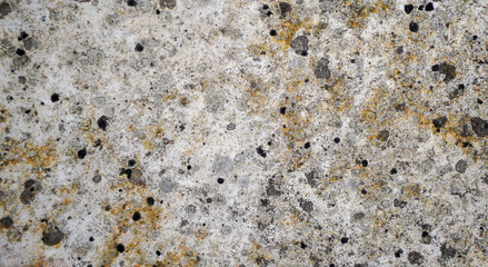 Stone structure of a stone slab, cut and processed from natural stone, photographed in daylight
