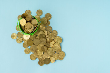 Business concept with a stack of coins on blue background. Copy space.