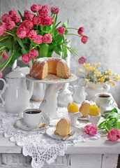 Easter cake. 
A traditional  cake with an easter decor. Easter eggs and spring flowers.