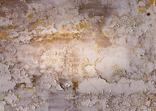 Closed up old peeling cracked paint on cement wall, vignett