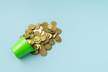 Business concept with a stack of coins on blue background. Copy space.