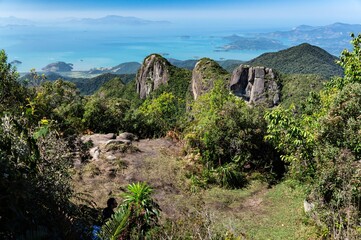 A small plain area between the viewing spots of Pedra da Macela landmark surrounded by vegetation...