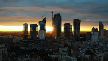 Astonishing red sunset over the Poland skyscrapers. Warsaw at night, aerial . High quality photo