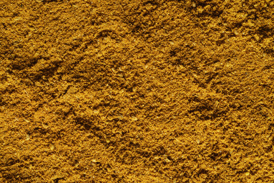 Dry yellow curry texture or background macro shot.