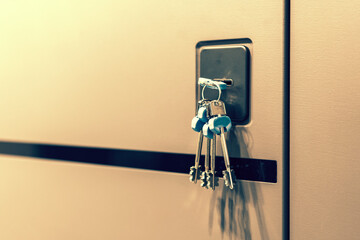 Keys stuck in a lock. closeup Door lock keys, Real estate concept door handle, Key insert and hold...