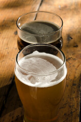 Full glasses of lager and stout, pints of craft beer