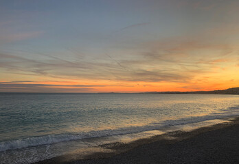 Fototapeta na wymiar Sunset on the French Riviera (Cote d'Azur). Pebble beach. Nice