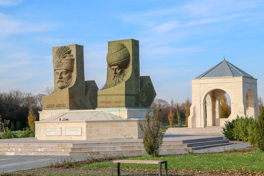 Sculptures of the head of Nikola IV zrinski and Sultan Suleiman Kanuni with symbolism tomb seen in the background in the Hungarian Park of Turkish Friendship, Csert, Szigetv&aacute;r, Hungary.