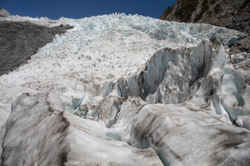 Landscape images from within the Franz Josef glacier showing varying forms of thick ice formations.