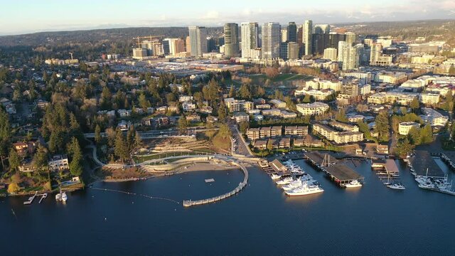Cinematic aerial drone footage of Meydenbauer Bay Park, Clyde, Eastland, beach park, marinas with Lake Washington Whalers Cove waterfront mansions in Belleview near Seattle, Washington