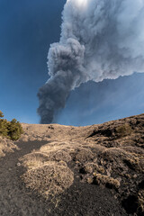 Spectacular eruption of the Etna volcano with column of smoke in the sky