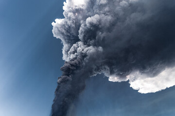 Incredible and frightening eruptive event of the Etna volcano, huge column of smoke in the sky. Catania - Sicily