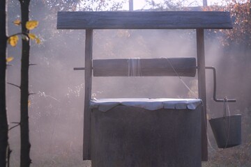 Fototapeta na wymiar well in morning fog