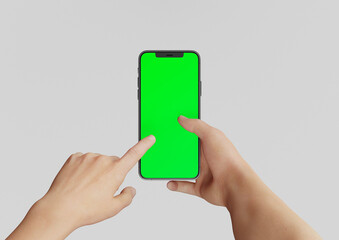 Hand or Hands holding an Iphone 12 Pro max and pointing,  3d render realistic mock up on white backgound with green screen to replace with your design