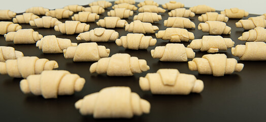 Ready to bake, lined mini croissants. fresh croissant dough
