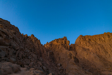 Obraz na płótnie Canvas Mountain in sand desert. Mountains and clear sky near Sharm El Sheikh, Egypt