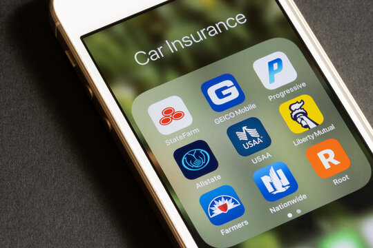 Portland, OR, USA - Mar 27, 2021: Assorted apps by American car insurance companies are seen on an iPhone - State Farm, GEICO, Progressive, Allstate, USAA, Liberty Mutual, Farmers, Nationwide, Root.