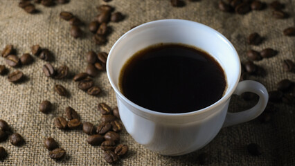 a cup of coffee and coffee beans