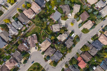 Calgary, Alberta, Canada, aerial top down view of houses and streets in beautiful residential...