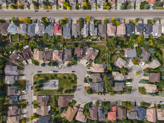 Calgary, Alberta, Canada, aerial top down view of houses and streets in beautiful residential...