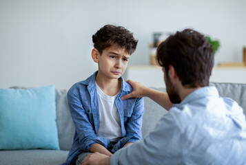 Father and sad son having heart to heart talk at home, daddy trying to solve problems, parent...