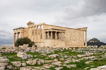 Fototapeta premium Ruin of the Erechtheion temple at Acropolis, Athens, Greece with tourists around