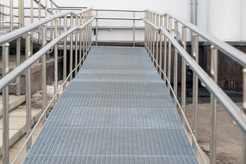 Metal ramp with railing for sedentary people