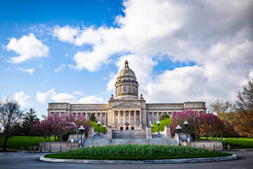 Frontal view of the Kentucky Capitol Building in the state capital of Frankfort with flowers of a...