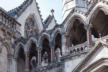 Fototapeta na wymiar London, UK - February 23, 2021: Royal Courts of Justice at Fleet Street called the Law Courts. Facade architectural detail