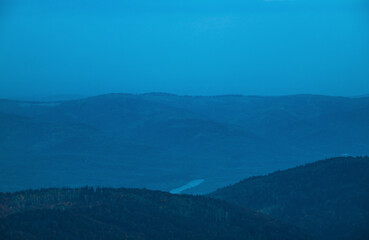Fototapeta premium Above view of evening sky and carpathian mountains 
