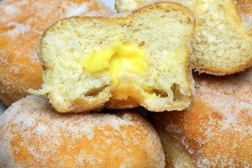 A Stack Of Custard Filled Doughnuts