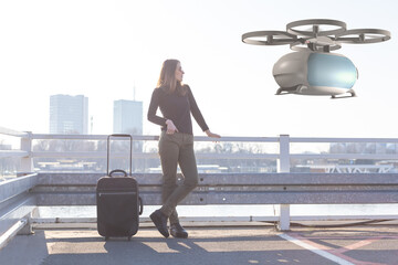 flying transportation drone picking up a passenger