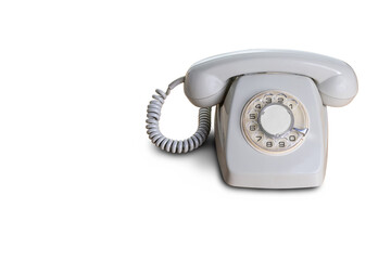 Vintage rotary dial telephone on white background