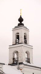 white brick bell tower of an orthodox church