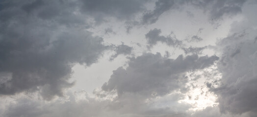 Panoramic atmosphere cloudy white sky banner. Clouds on light backdrop. Gray horizontal poster design. Minimal concept for heaven freedom. Beautiful space with sun cloud and light