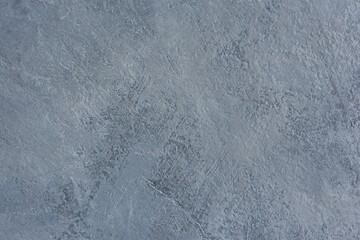 Grey abstract acrylic background. Textured imitation of a dark gray concrete surface. Rough cold background with brush movement stripes. Blank layout for design, postcards, banners with copy space