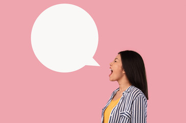 Emotional asian lady screaming at white speech bubble