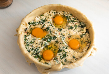 Ricotta pie with eggs on top