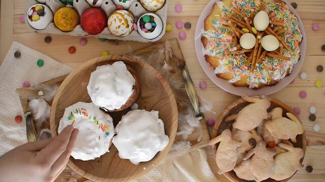 Easter. Decorating Easter cakes with colored sugar canfetti. homemade baking
