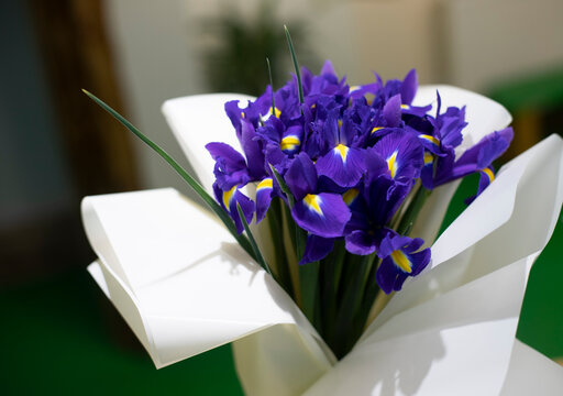 A beautiful bouquet of fiolet iris flowers. Background pattern with flowers